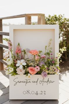 a sign with flowers on it that says samma and anthony