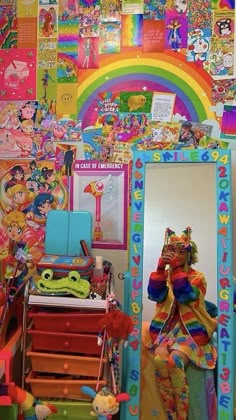 there is a colorful room with many pictures on the wall and toys all around it