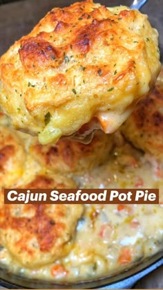 a close up of food on a plate with a spoon in it and the words cajun seafood pot pie