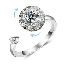 a diamond ring with an arrow pointing towards it