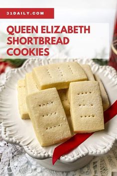 queen elizabeth shortbread cookies on a white plate with red ribbon in front of it