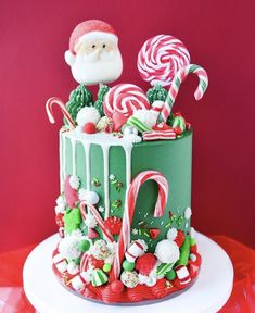 a christmas cake decorated with candy canes and candies