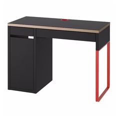 a black desk with red legs and a wooden top