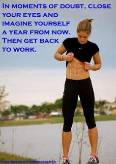 a woman standing on top of a rock next to a lake with the caption, in moments of doubt, close your eyes and imagine yourself