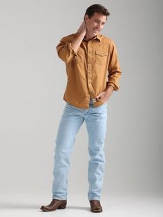 A WARDROBE CLASSIC FOR EVERY COWBOY For more than 70 years, our 13MWZ Cowboy Cut® jeans have been a tried-and-true wardrobe staple for cowboys across the country. Today, 13MWZ is the official ProRodeo competition jean. We knew a good thing when we saw it, which is why the Wrangler® Cowboy Cut® jeans haven't changed much since they were first designed by 'Rodeo Ben' Lichenstein in 1947. These comfortable, durable jeans come fully equipped with all the authentic details you'd expect from a hallmar Wrangler Cowboy Cut Jeans, Cowboy Cut Jeans, Wrangler Cowboy, Modern Cowboy, Wrangler Cowboy Cut, Toddler Tops, Plus Size Tees, Mens Cowboy, Cowboy Style