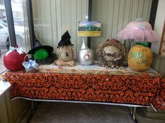 a table topped with lots of halloween decorations