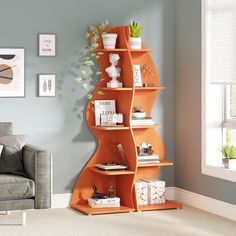 an orange shelf in the corner of a living room