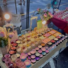 a table filled with lots of cupcakes and cakes