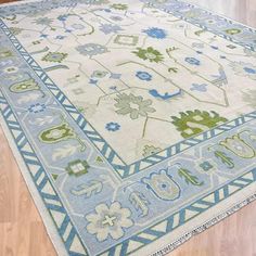 a blue and green rug on the floor