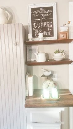 the shelves in this kitchen are filled with items