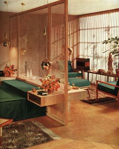 a living room filled with lots of furniture and plants on top of it's windowsill