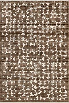 a brown and white rug with an intricate design