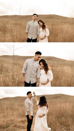 a pregnant couple standing in the middle of a field