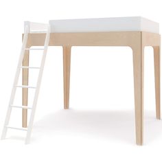 a white ladder sitting next to a wooden table with a bed on top of it