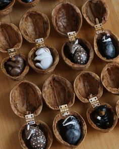 chocolate candies are arranged in wooden bowls on a table