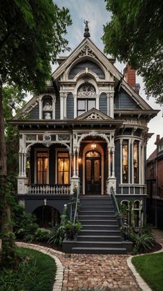 an old victorian house with stone steps leading up to the front door