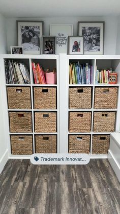 the bookshelves are full of books and baskets in this small room with wood flooring