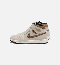 Dressed in a Light Orewood Brown, Metallic Gold, White, Light British Tan, and Sail color scheme. This offering of the mid-top Air Jordan 1 features a White leather base with suede overlays and Gold branding. Highlighting the shoe is the Brown elephant print used on the ankle collar and Swooshes to complete the design. Brown Jordan 1, Air Jordan 1 Retro Mid, Air Jordan Mid, Jordan 1 Retro Mid, Suede Creepers, Nike Sb Shoes, Jordan Shoes For Women, Nike Shoes Women Fashion, Jordan Mid