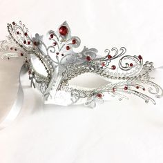 This mask captures the spirit of the clever and graceful fox, making it an ideal choice for those who appreciate its symbolism. Designed for hours of wear, it ensures you can enjoy the festivities in style and comfort. Adorned with rhinestones, this mask sparkles in the light, ensuring you'll shine bright at any masquerade ball, themed party, gala, and other events!


Age Group/Gender - Adult/Women

Size/Type - One size fits all adults

Mask Color - White/Silver

Mask Material - Polyresin/Laser White And Red Masquerade Mask, Luxury White Masquerade Mask For Carnival, Fox Masquerade Mask, Masquerade Masks For Men, Prom Masquerade, Masquerade Mask Women, Silver Mask, Metal Mask, Fox Mask