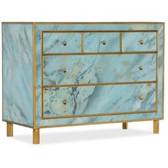 a blue marble dresser with gold trimmings on the top and bottom drawers, against a white background