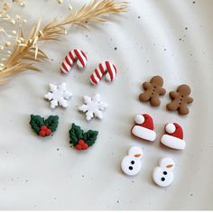 christmas cookies and decorations on a white surface