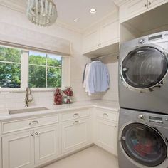 a washer and dryer in a white kitchen