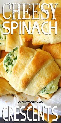 cheesy spinach crescent pastries on a white plate with text overlay