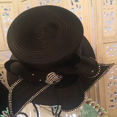 Perfect For Any Occasion, Especially Opening Day At The Races. Classy And Elegant. 100% Polyester. The Special Details Of The Rhinestones And The Ribbon Like Design Make It A Must Have In Your Hat Collection. It Can Be Adjusted To Your Size. Elegant Evening Hats With Rhinestones, Black Evening Hat With Rhinestones, Black Evening Hats With Rhinestones, Black Hat With Rhinestones For Evening, Elegant Black Hats With Rhinestones, Elegant Embellished Hats For Formal Occasions, Elegant Embellished Formal Hats, Elegant Bedazzled Hats, Formal Fitted Embellished Hat