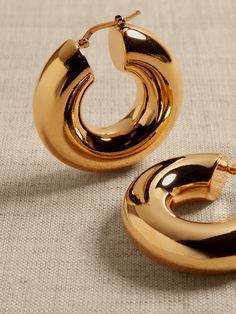 Perfectly-sized polished hoops with a plump profile and hollow core are made of bronze.  Timeless Classics: Luxury, everyday.  A showcase of time-honored craftsmanship and skilled Italian artisans, these are the pieces you'll reach for season after season, delighting in their exceptional versatility and endless appeal.  Hinged post backs.  12K-gold plated or silver-plated bronze.  Made in Italy.  Length: 1. 5" Wedding Stack, Hoop Earrings Aesthetic, Large Gold Earrings, Bold Statement Jewelry, Jewelry Photoshoot, Hoops Gold, Bronze Earrings, Bling Shoes, England Style