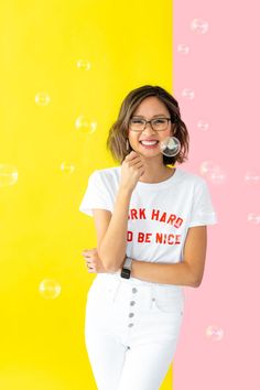 a woman wearing glasses and a t - shirt