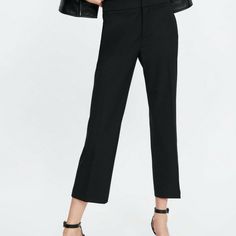 Black Mid-Waist Trousers With Front Pockets And Back Welt Pockets. Featuring Flared Hems And Metal Hook, Inside Button And Zip Fastening In The Front. 67% Polyester, 29% Viscose, 4% Elastane Size 2 Waist - 15" Hips - 18" Inseam - 26" Length - 34" Leg Opening - 9" High Waist Work Pants For Spring Office, Chic Ankle-length Pants For Office Wear, Elegant Mid-rise Black Bottoms, Elegant Black Mid-rise Bottoms, Zara Ankle-length Wide Leg Workwear Pants, Zara Ankle-length Wide Leg Pants For Work, Zara Stretch Pants For Office, Zara Stretch Office Pants, Zara High-waisted Pants For Business Casual