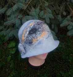 For those who want to look original in any weather, I offer a hat with a brim, handmade from felt. The hat was created by me using the wet felting method from merino wool, viscose, decorative threads and natural silk. The hat is made by hand - only wool, water and soap. A one of a kind hat and you will stand out from the crowd. The bucket hat has an original design created by me from merino wool and decorative fibers. The height of the crown of the hat is 18 cm. The size of the bucket hat is 57- Winter Felt Cloche Hat With Short Brim, Unique Winter Brimmed Hat, Unique Brimmed Winter Hat, Handmade Wool Felt Hat For Winter, Handmade Winter Bucket Hat With Short Brim, Handmade Cloche Hat For Winter, Handmade Cloche Winter Hat, Handmade Winter Cloche Hat, Handmade Cloche Hat With Curved Brim For Winter