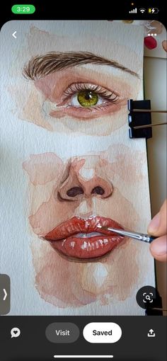 someone is painting their face with watercolors on paper and using scissors to draw it