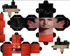 an origami model of a soccer player with his hair styled in black and orange