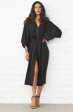 Eco friendly caftans and tunics inspired by the ocean, made on main street. Ethically sourced and locally made in Los Angeles. When we travel, we want clothes that take up minimum space but do maximum work. Meet the Kimono Wrap Duster in Black. It's a dress. It's a duster. It's a robe. It's a cover-up. This one does it all and we couldn't be happier! As a dress, two discreet buttons keep the wrap securely in place and give the dress an architectural drape. The removable self-tie belt can be add Belt Kimono, Kimono Wrap Dress, Kimono Duster, Black Kimono, Kimono Wrap, By The Ocean, Be Happier, Kimono Sleeve, Black Wrap Dress