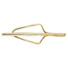 Rare vintage Tiffany & Co. mens baseball bat money clip / tie bar in 14 karat yellow gold. This elegant and versatile piece is perfect for the sports enthusiast in your life! This unique item from Tiffany & Co. features a polished 14 karat yellow gold elongated baseball bat motif with a brushed gold handle. The wide, open base is easily accessible and can accommodate items in varying degrees of thickness. It is perfect for accenting a regal looking tie, or elegantly clipping your dollar bills to Vintage Tiffany, Dollar Bills, Gold Box, Gold Handles, Tiffany And Co, Dollar Bill, Tie Bar, Money Clip, Tiffany & Co.