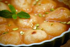 a dish filled with food and garnished with green leaves