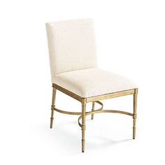 a white chair with a gold frame and seat cushion on top of it, against a white background