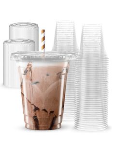 there are many plastic cups with drinks in them