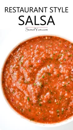 a white bowl filled with salsa on top of a table