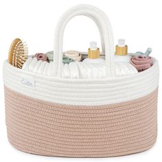 a large white and beige basket with lots of items in it on a white background