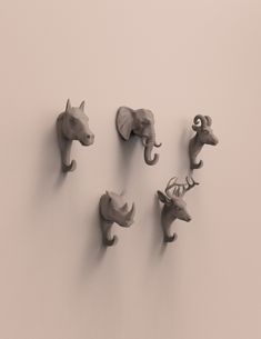 five different animal heads mounted to the wall