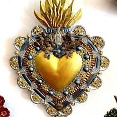 a heart shaped brooch hanging on the wall