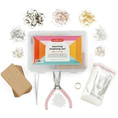 crafting supplies including scissors, paper clips and other items on a white background with clippings