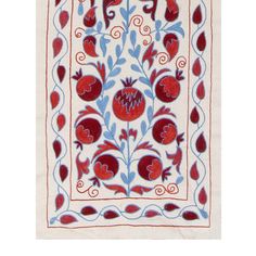 a red and blue floral design on a white background with swirls, hearts, and leaves