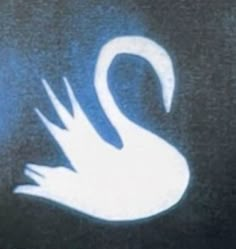 a white swan is on the side of a black car with blue light behind it