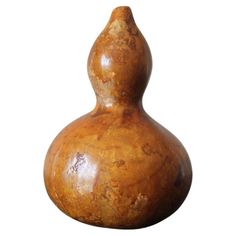 a wooden vase is shown against a white background