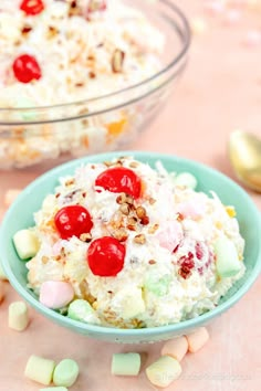 two glasses filled with ice cream and cherries