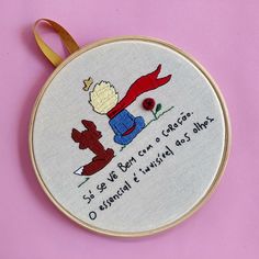 a cross stitch pattern on a wooden hoop