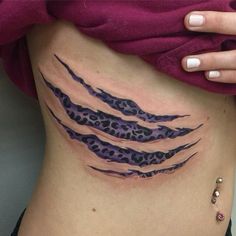 a woman's stomach with an animal print design on the bottom and lower side